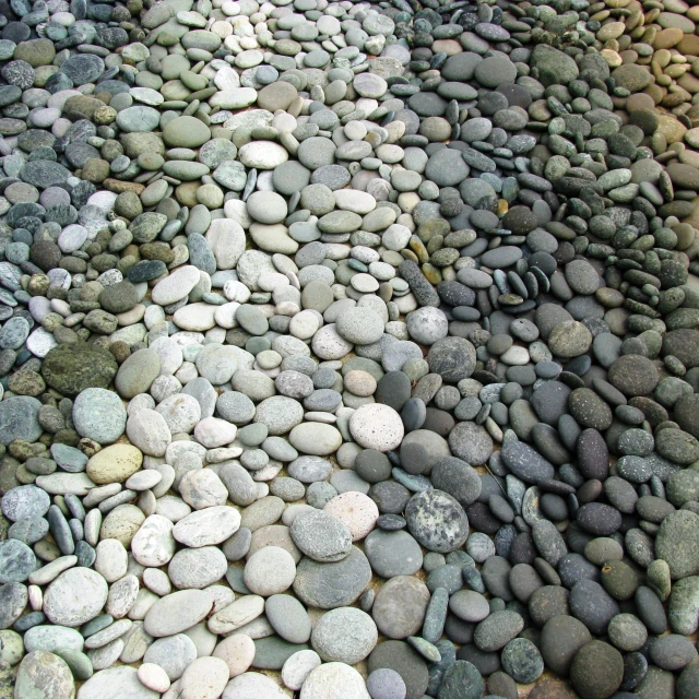 a sidewalk that has rocks all over it