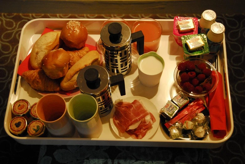 a table with some assorted food in a tray