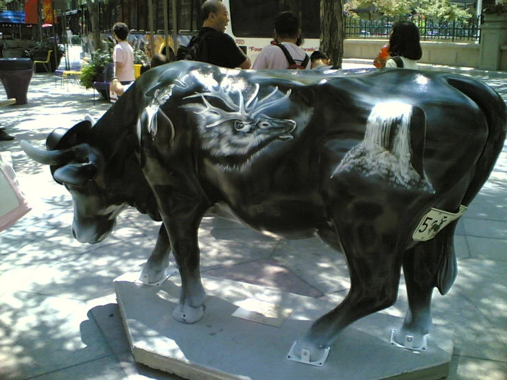 a statue of two bulls that are outside