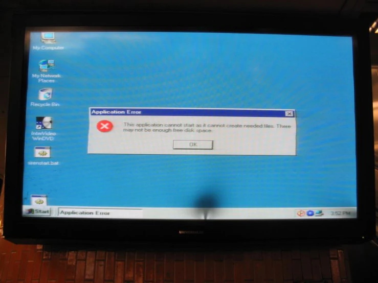 a flat screen tv showing an important error