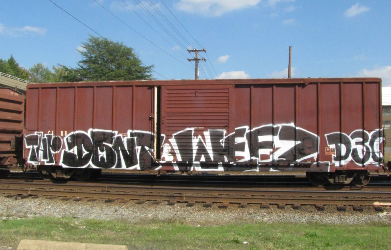 the train is tagged with the word'boo'in grafitti