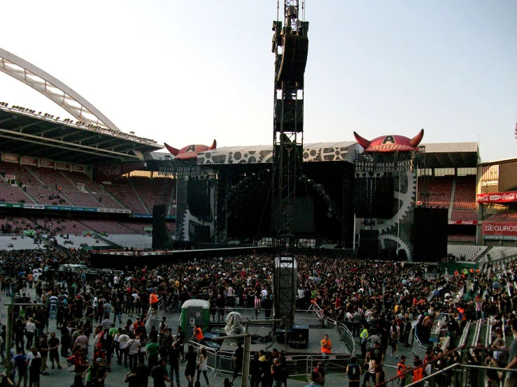 a crowd gathered at an outdoor concert venue