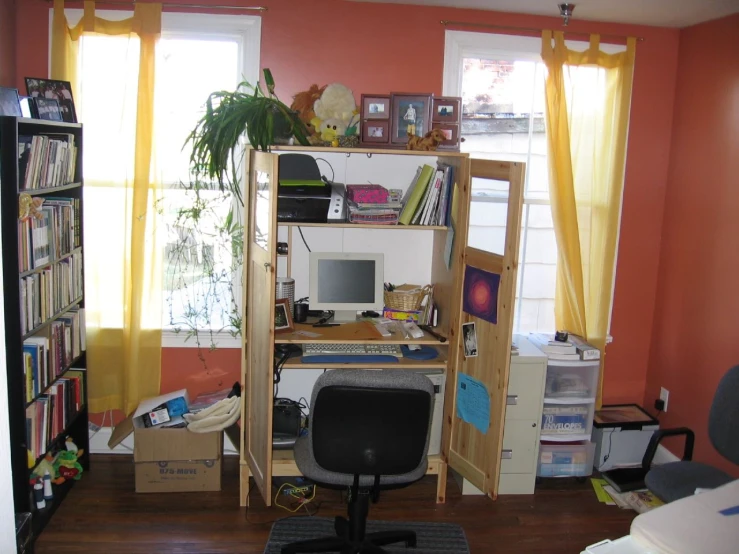 an office with desk, bookcase and shelves