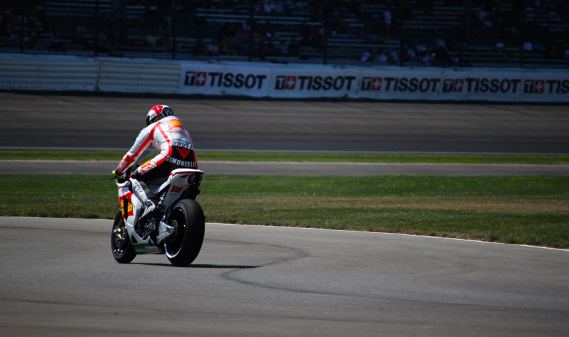 a person on a motorbike riding on the track