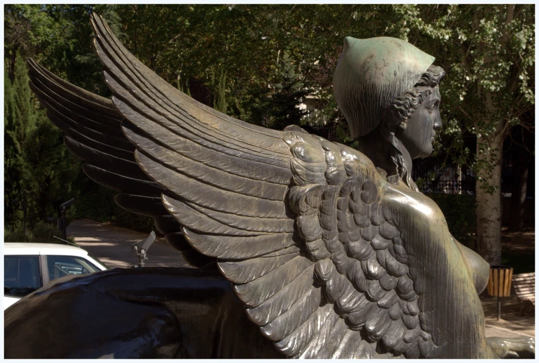 an image of a statue with wings on it