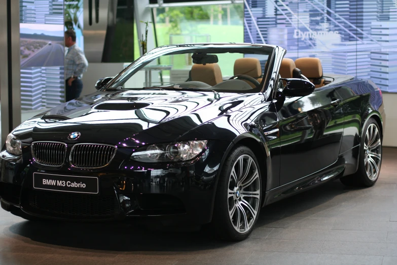 a bmw vehicle is shown on display in a showroom