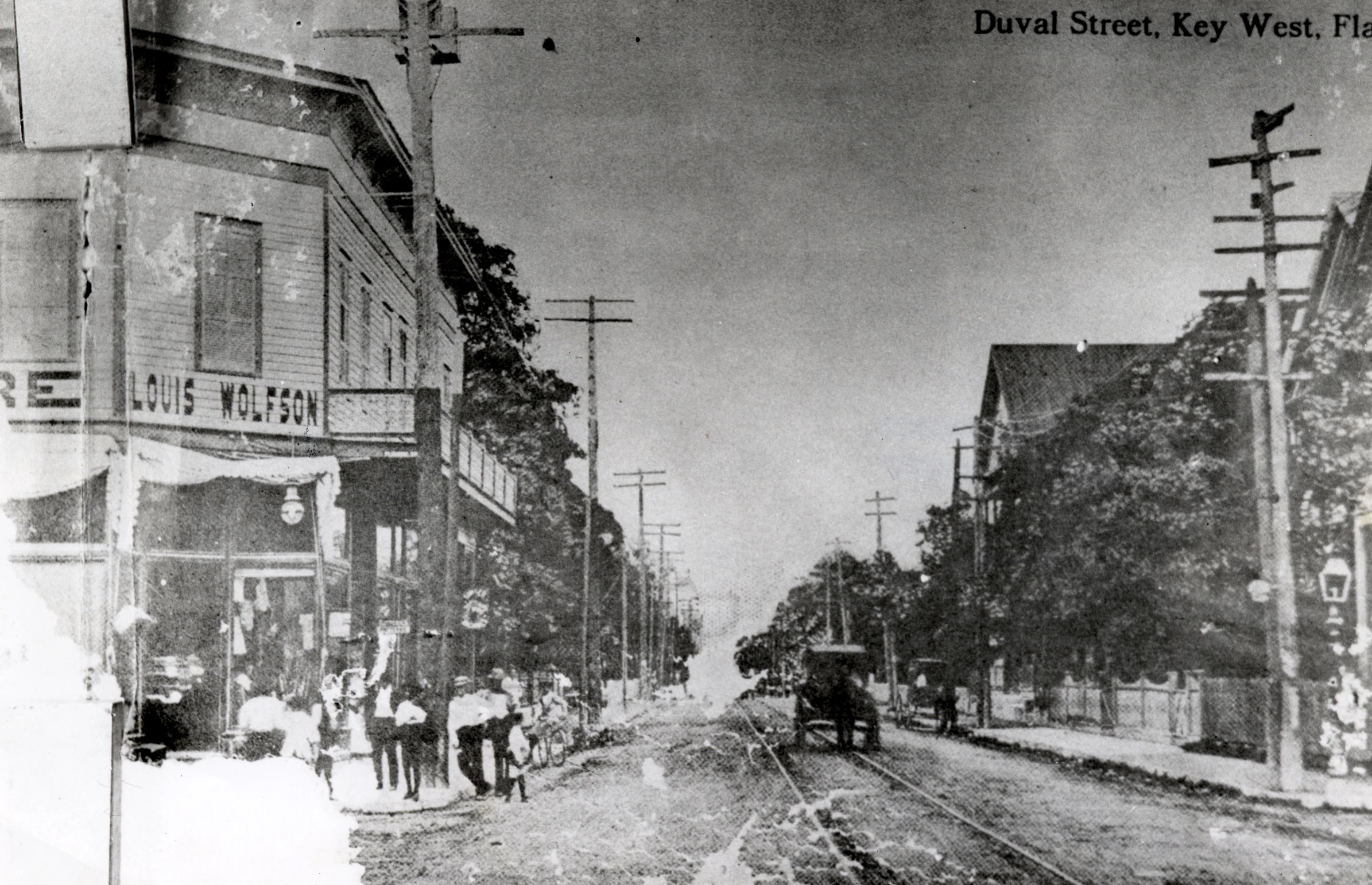 a horse and carriage on a street in the past