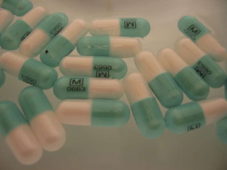 some pills are filled with green and white pills