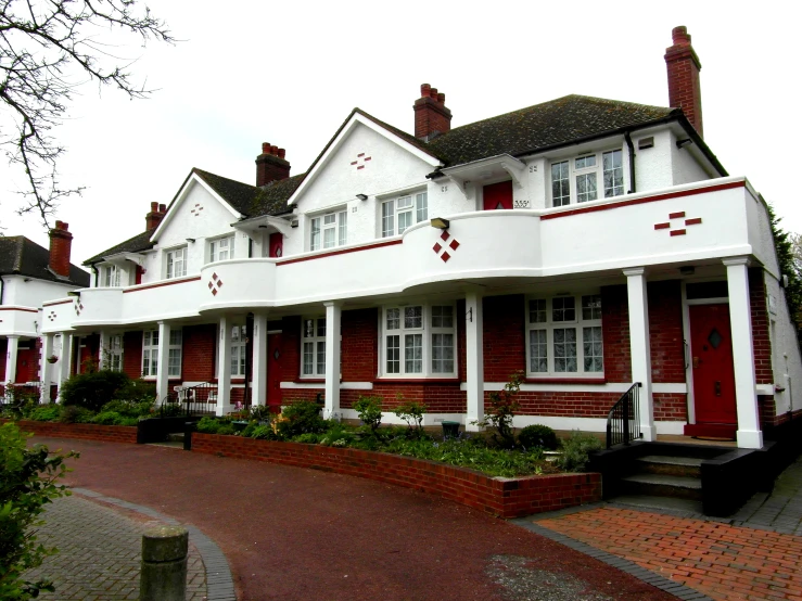 a row of houses in front of some trees