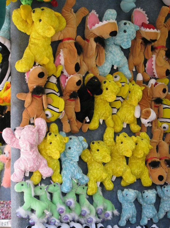 various colored plush toys lined up next to each other