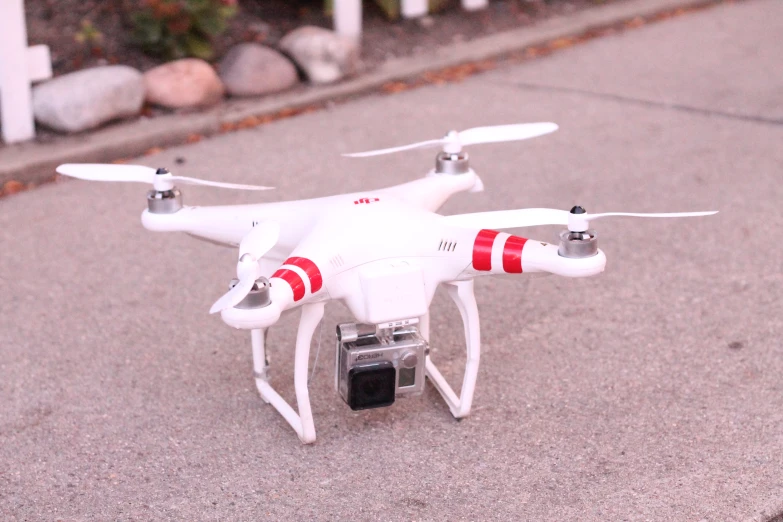 a toy white plane with a red and white flag on it