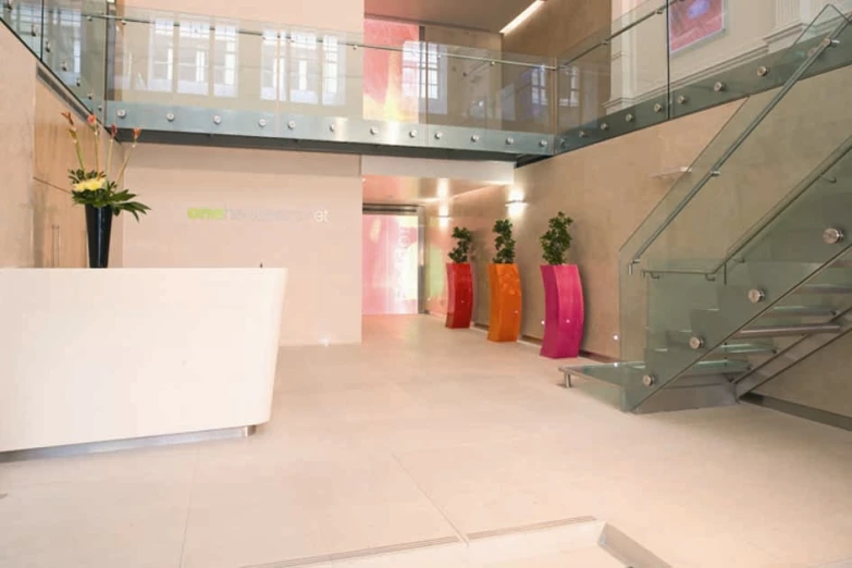 a staircase leading up to a large white and pink reception