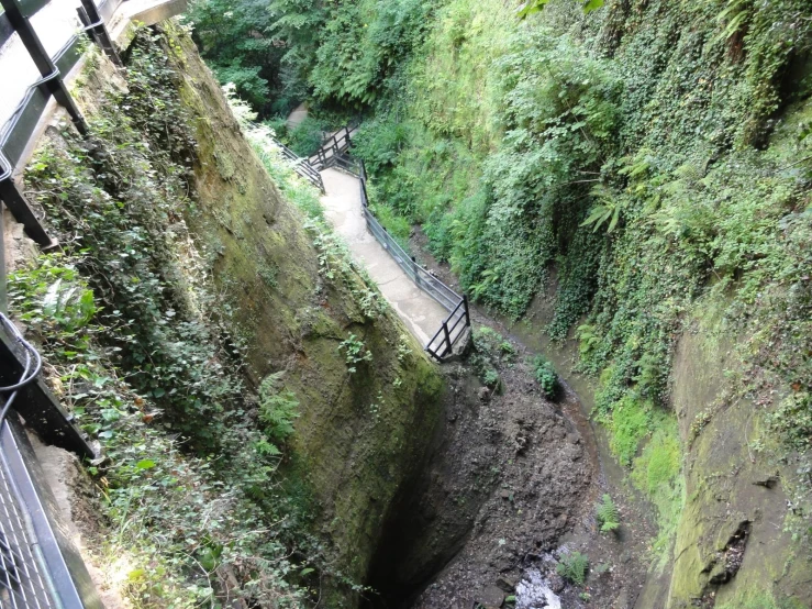 an aerial view of the top of a mountain looking down at a drainage