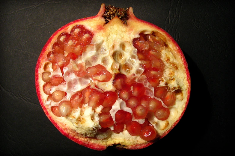 a large pizza sitting on top of a black surface