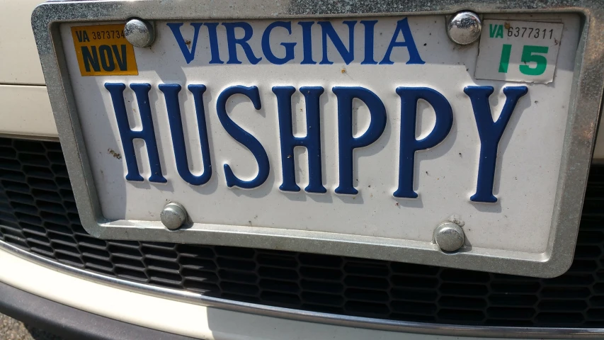 a close up of a license plate on the front of a car