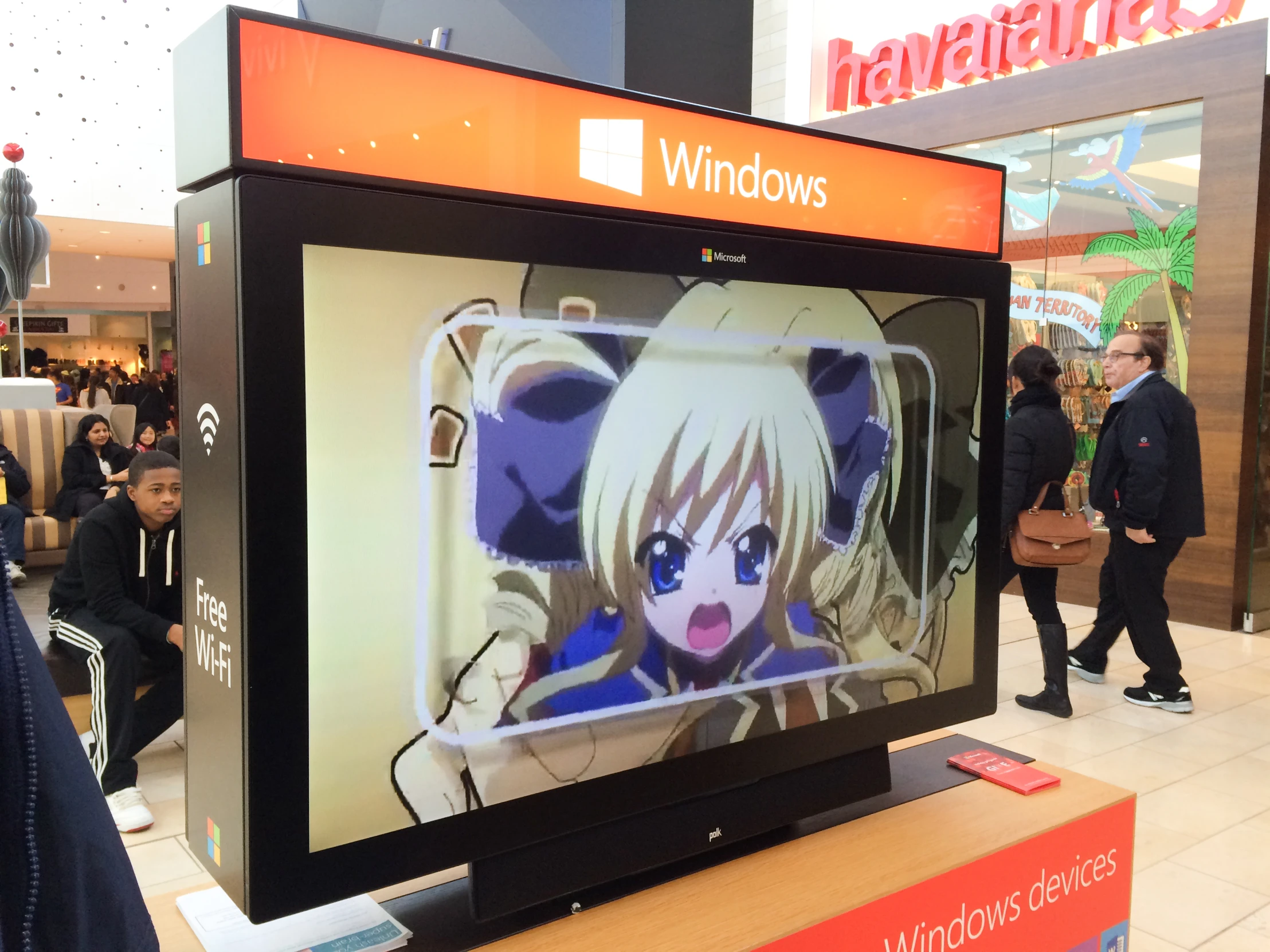 a display area with a wide screen in a mall