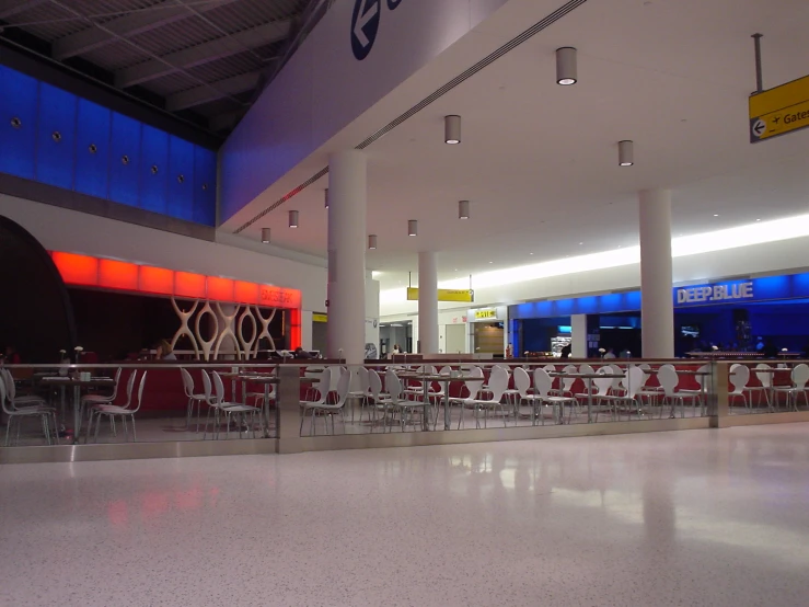 a large room with a white ceiling and white floors