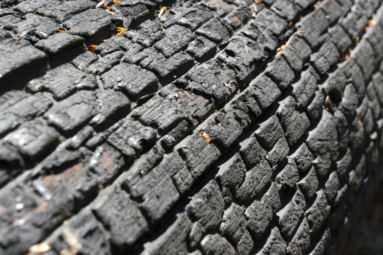 an old tire with little rust lying on it