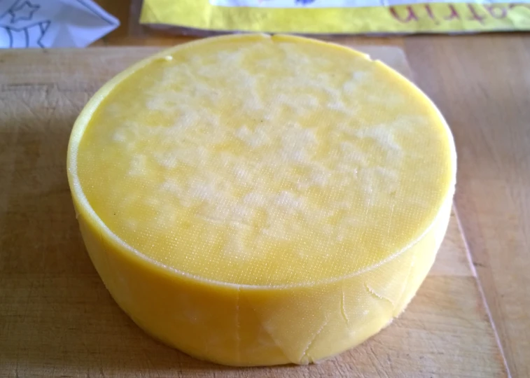 the large cheese has been cut into three pieces