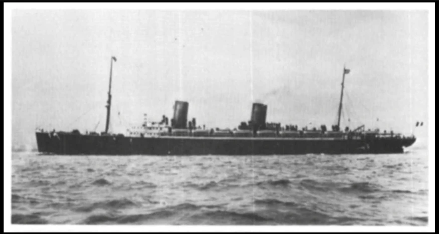 a large ship sailing through the ocean on a cloudy day