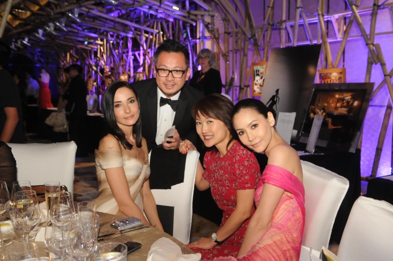 a group of people that are sitting at a table