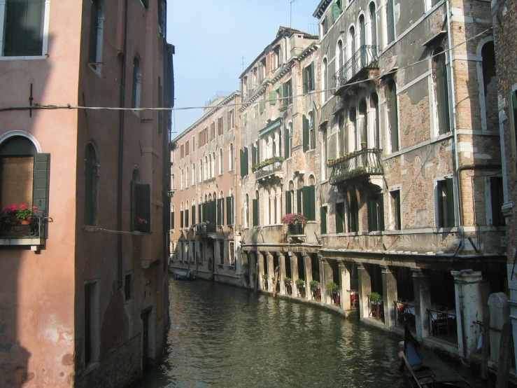 old buildings that have been converted into apartments by the canal