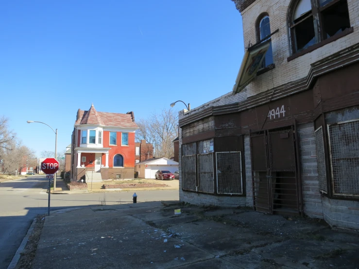 an old run down brick building on the corner of a street