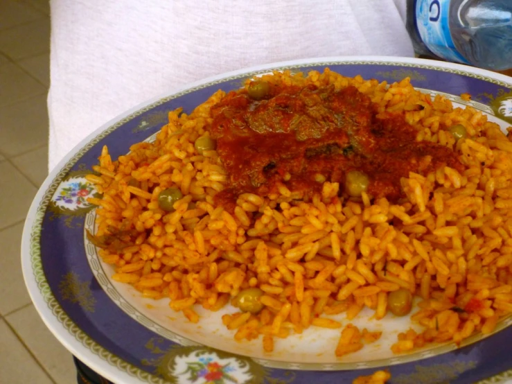 there is rice on the plate that is full of stuff