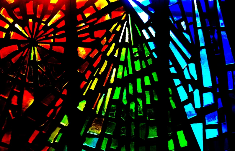 a close up view of a stained glass window with color bars coming out