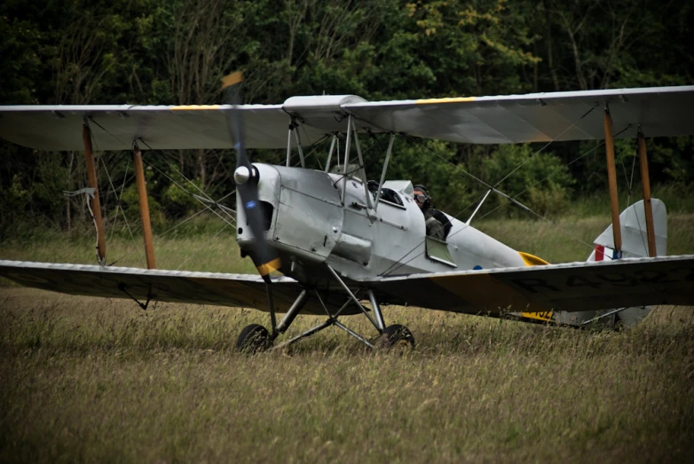 a gray airplane is sitting on the ground