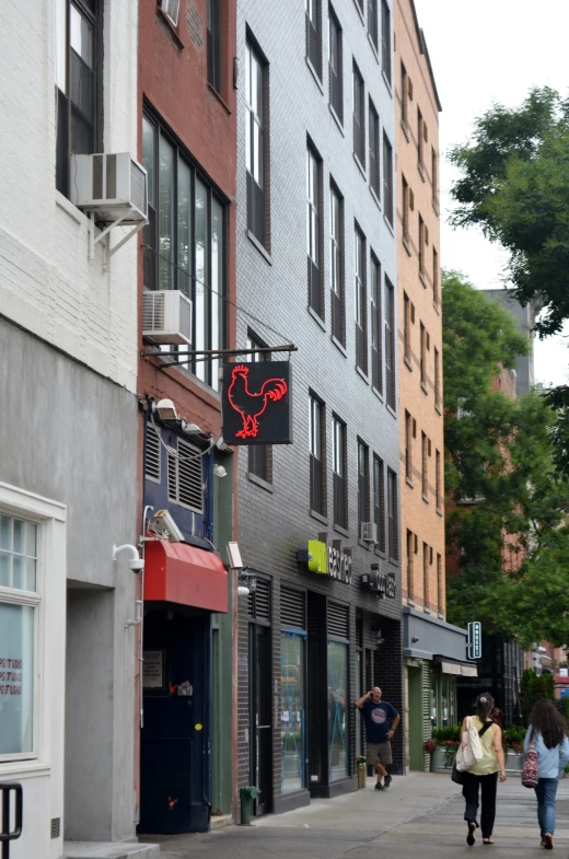 pedestrians walking on the sidewalk in an urban area