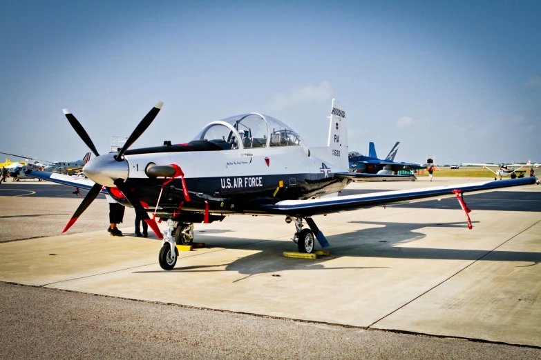 a small plane is sitting on the tarmac