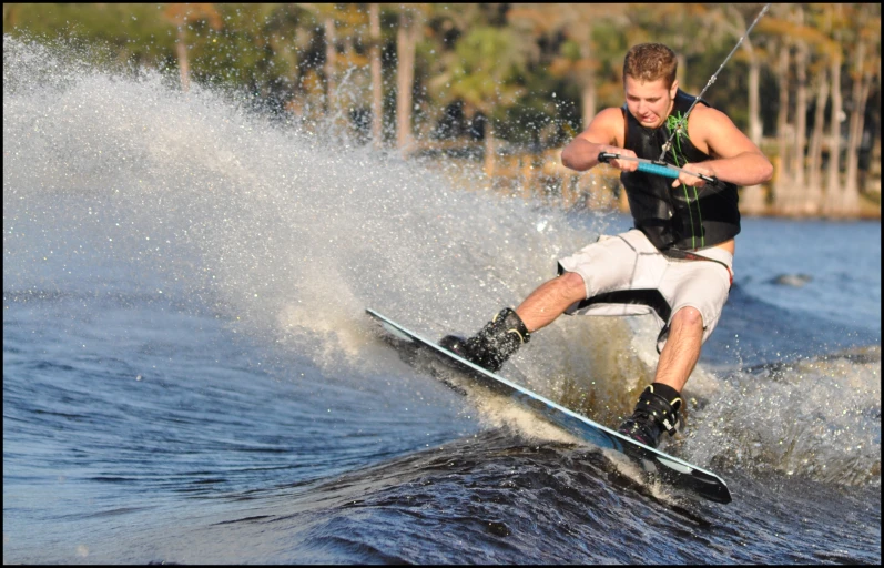 a man on skis being towed on a lake