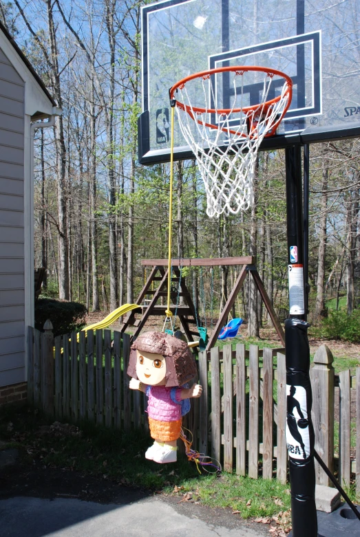 a toy is hanging on a basketball court