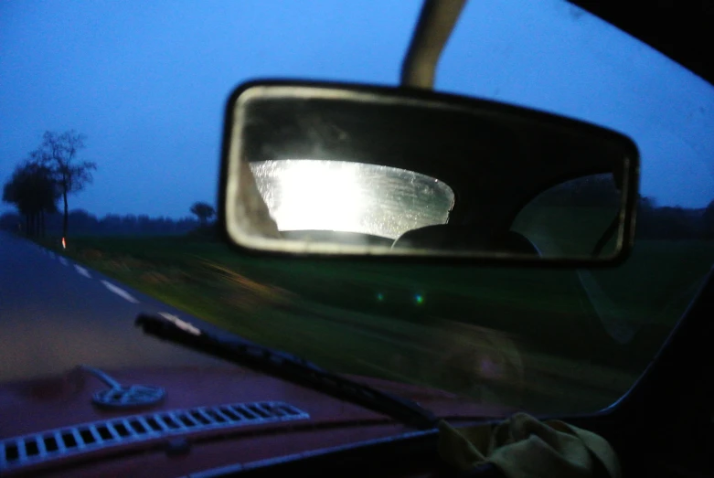 a rear view mirror that is on the back of a car