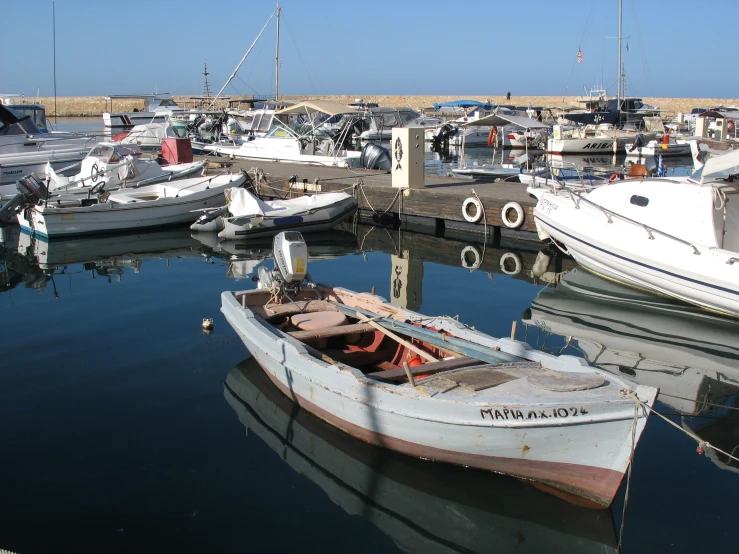 a marina full of boats sitting around a body of water