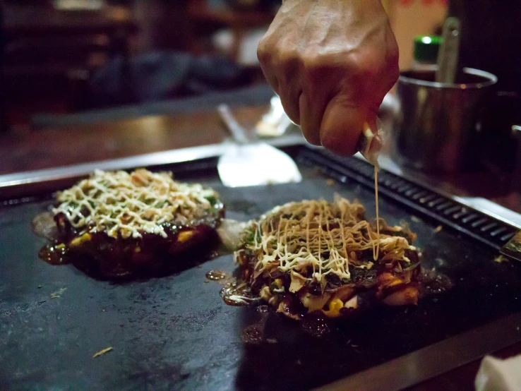 some kind of food is being cooked on a pan