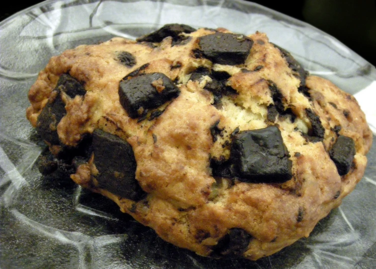 an image of a chocolate chip cookie on a plastic plate