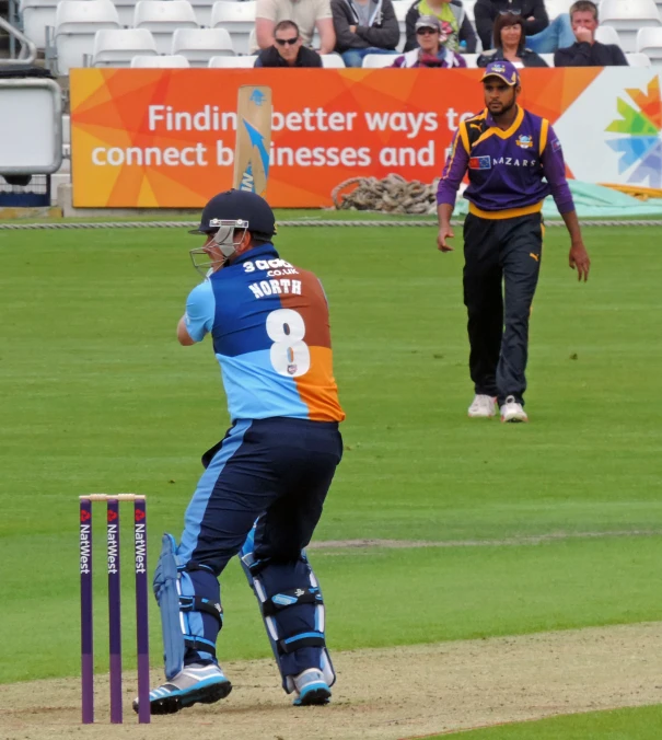 a man holding a cricket bat during a game