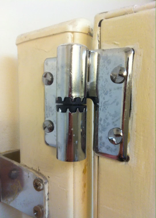 a close up of a door latch and a metal object