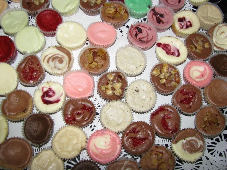 an image of a tray of cupcakes with frosting