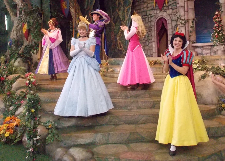 princesses dressed up in costume for a princess party