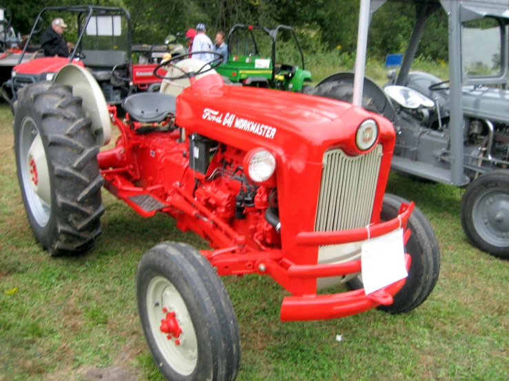 this is an old tractor on display at a show