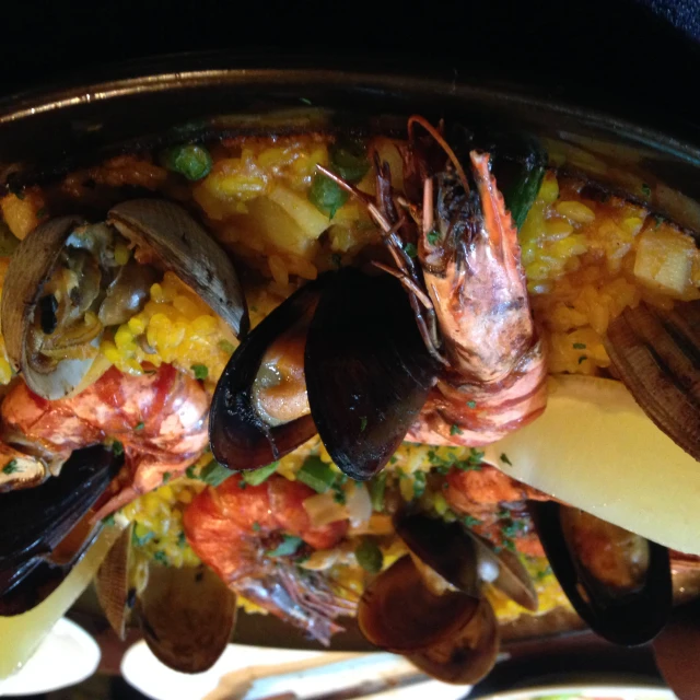 seafood platter with mussels and other foods served on tray