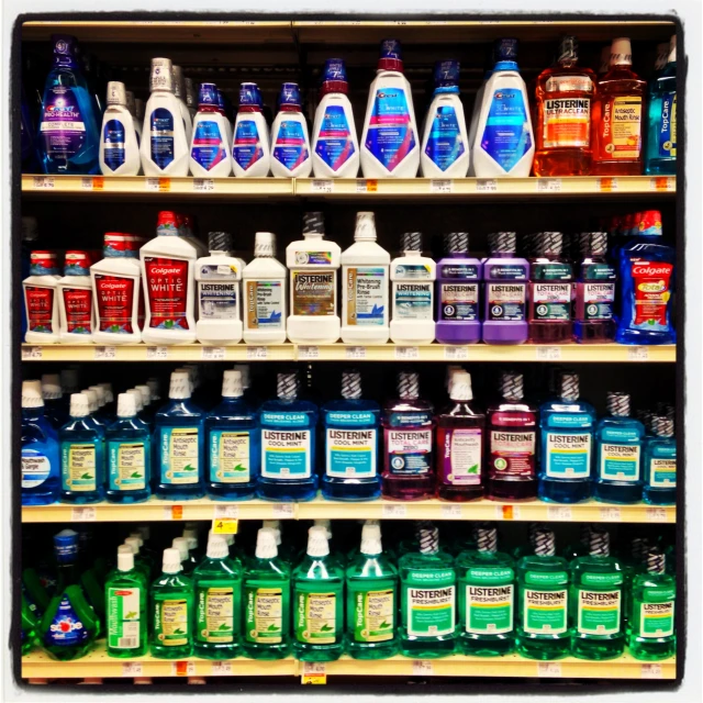 a display of bottles and containers filled with liquid