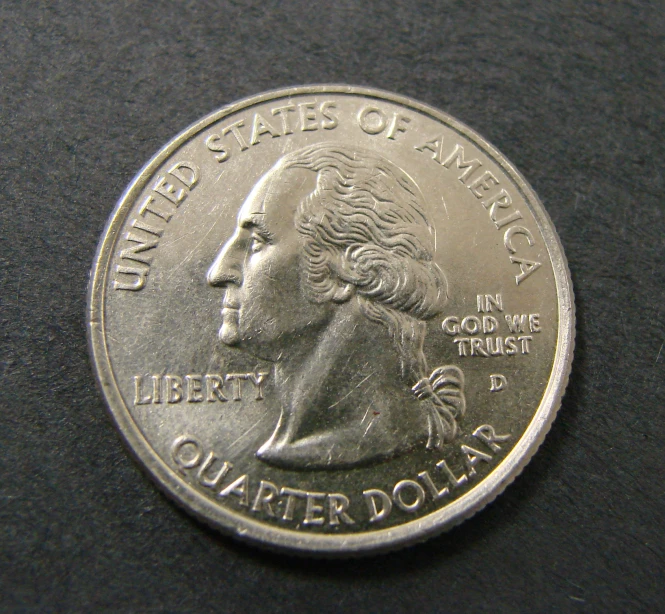 a silver coin that is very close to the camera