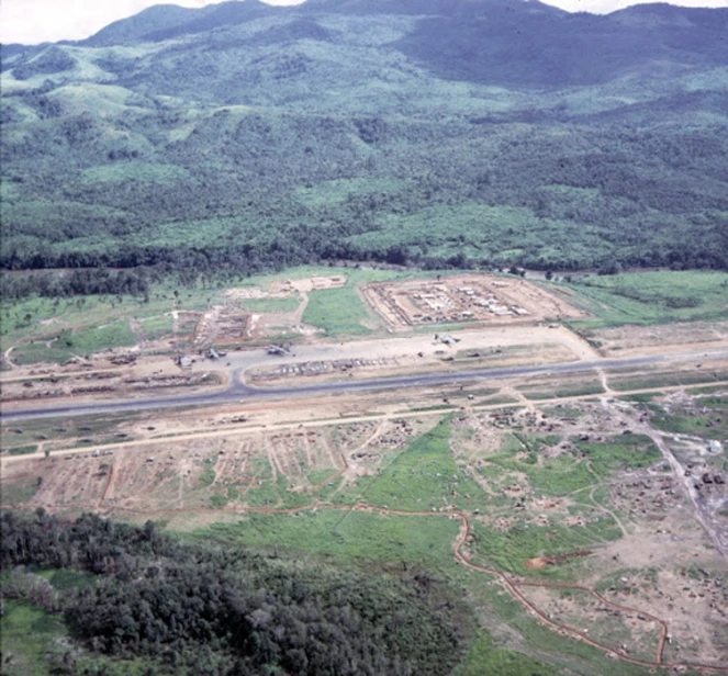 a road and building site in a rural area