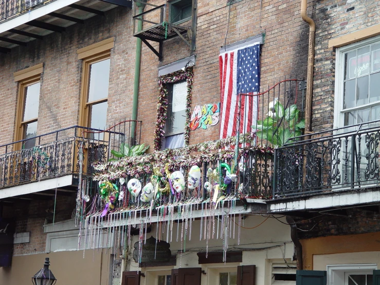 an old building has ornaments hanging outside