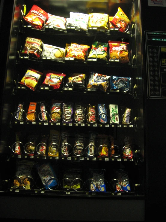 there is a vending machine with snacks inside