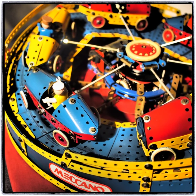 a close up of a toy train playing with it's wheels